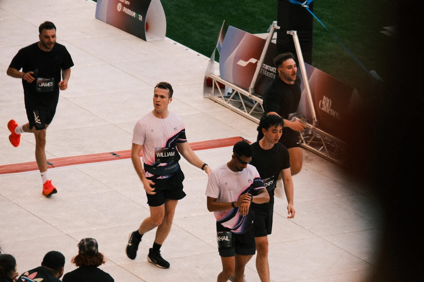 Runners moving through an indoor race
